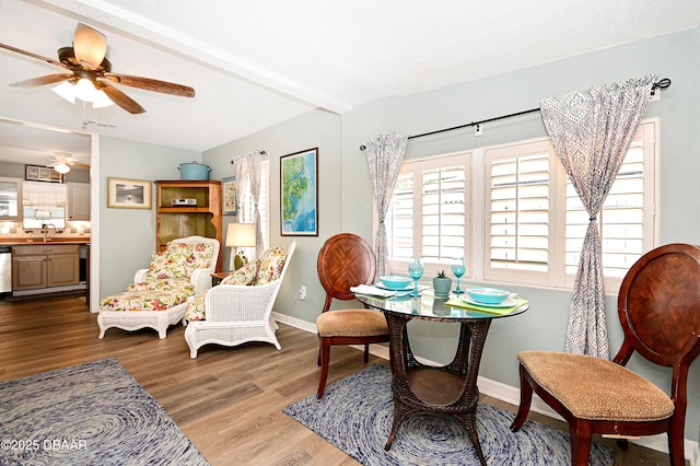 530 Ronnoc Ln, New Smyrna Beach, FL 32168 - living area featuring wood finished floors, visible vents, baseboards, and ceiling fan