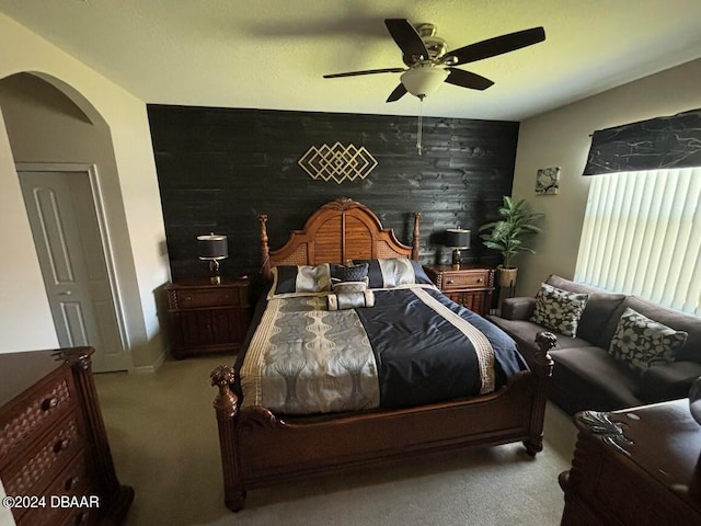 carpeted bedroom featuring ceiling fan