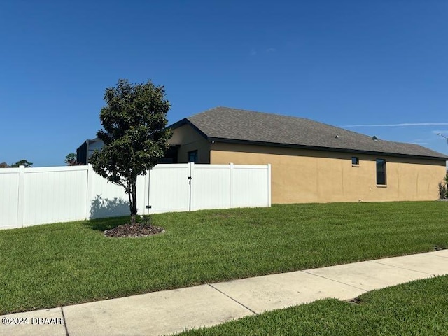 view of home's exterior featuring a yard