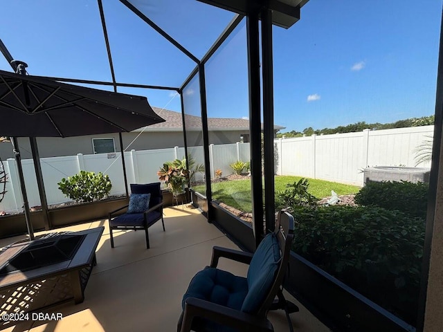 view of patio featuring a lanai