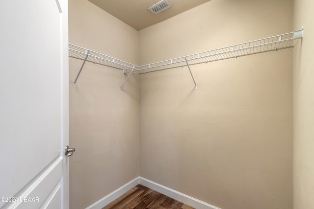 spacious closet featuring hardwood / wood-style flooring