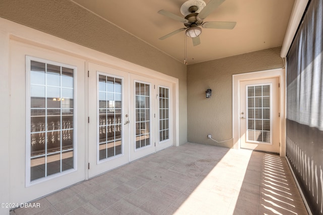 view of patio featuring ceiling fan and french doors