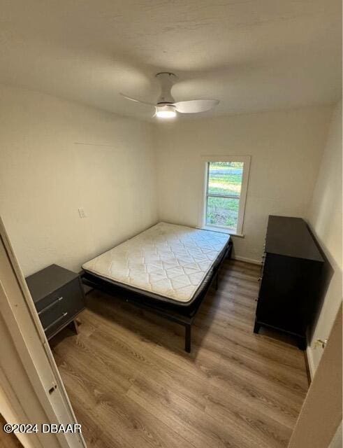 unfurnished bedroom featuring a ceiling fan and wood finished floors