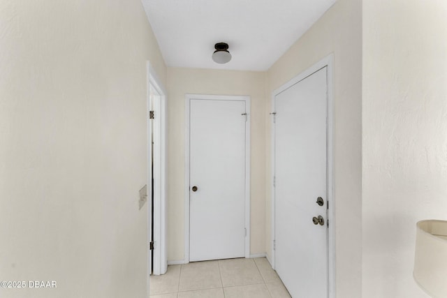 entryway featuring light tile patterned floors