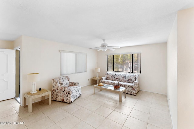 living room featuring light tile patterned flooring and a ceiling fan