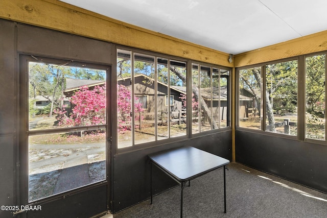 unfurnished sunroom featuring plenty of natural light