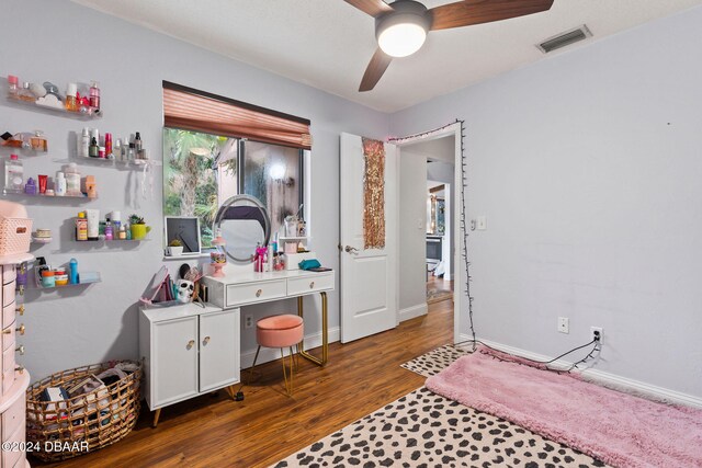 bedroom with ceiling fan and dark hardwood / wood-style floors