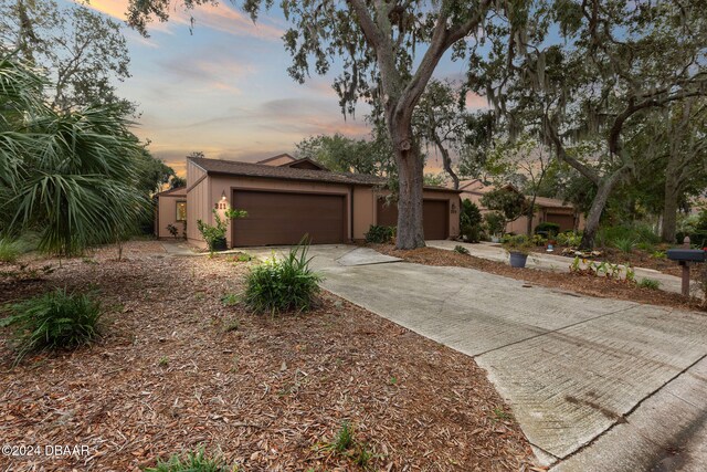 ranch-style home with a garage