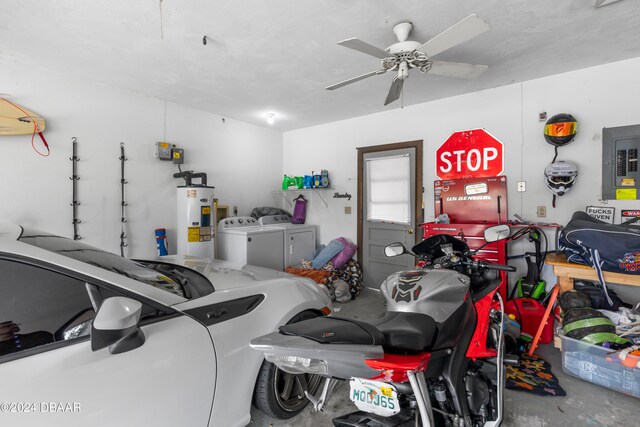 garage with electric panel, washing machine and clothes dryer, electric water heater, and ceiling fan