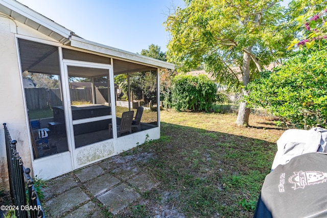 view of yard with a sunroom