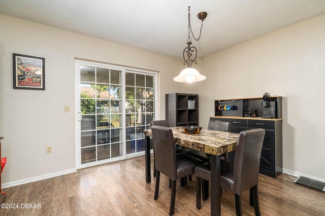 dining area with hardwood / wood-style flooring