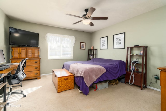 bedroom featuring ceiling fan and light colored carpet