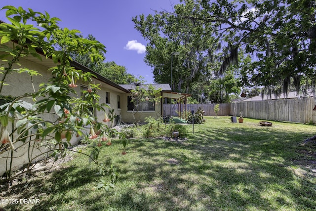 1970 Red Cedar Cir S, Daytona, FL 32119 - view of yard featuring fence and a fire pit