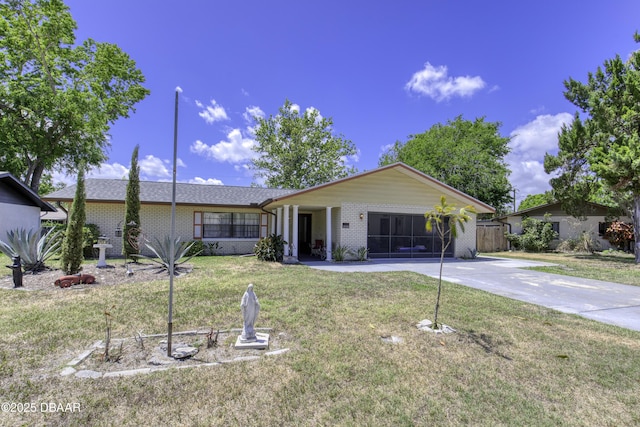 1970 Red Cedar Cir S, Daytona, FL 32119 - single story home featuring brick siding, driveway, fence, and a front yard