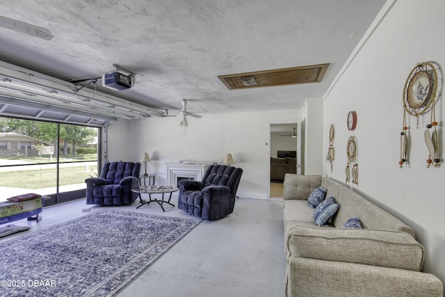 1970 Red Cedar Cir S, Daytona, FL 32119 - living area with finished concrete flooring, a fireplace, and attic access