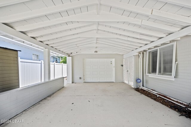 garage featuring a carport