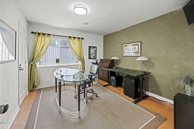 office area with light hardwood / wood-style floors