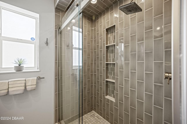 bathroom with a tile shower