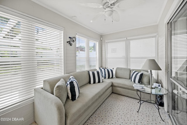 living room featuring ceiling fan and crown molding