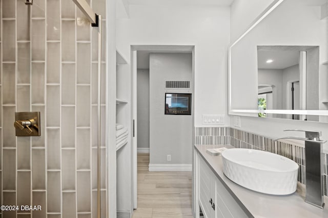 bathroom featuring wood-type flooring and vanity