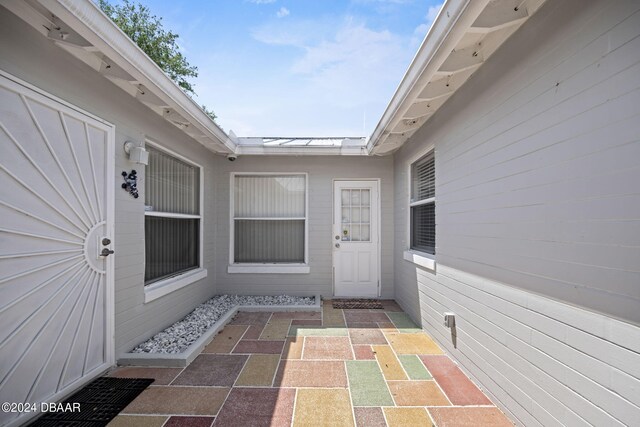 entrance to property with a patio