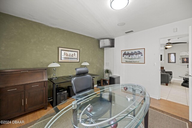 office space with light wood-type flooring and ceiling fan