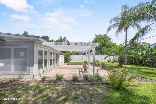 view of yard with a patio and a pergola