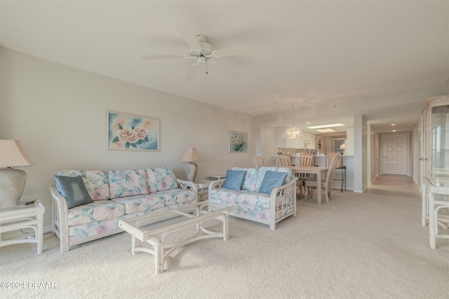 carpeted living room featuring ceiling fan