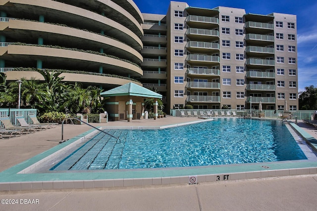 4 Oceans W Blvd Unit 407B, Daytona Beach Shores, FL 32118 - community pool with a patio area and fence
