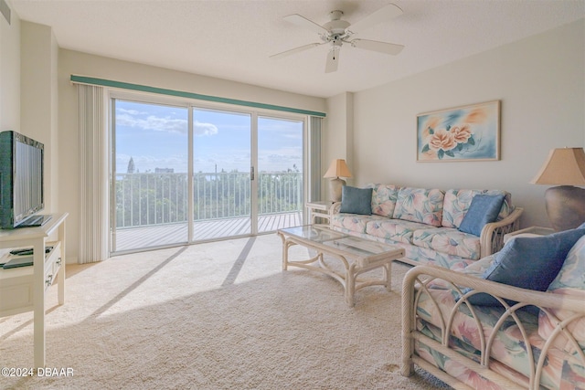 living room with carpet and ceiling fan