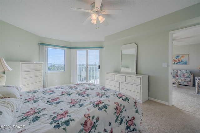 4 Oceans W Blvd Unit 407B, Daytona Beach Shores, FL 32118 - bedroom with light carpet, access to exterior, and a ceiling fan