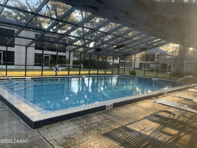 view of pool with a lanai