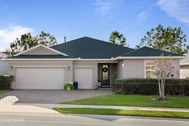 ranch-style home with a front yard and a garage