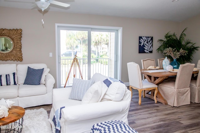 living area featuring a ceiling fan and wood finished floors