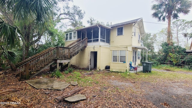 back of property featuring a sunroom