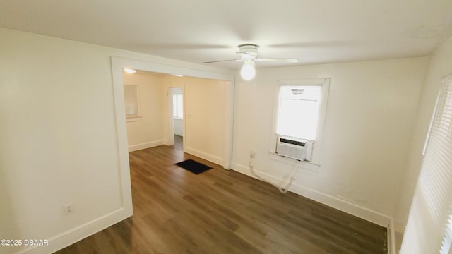 unfurnished room featuring ceiling fan, dark hardwood / wood-style flooring, and cooling unit