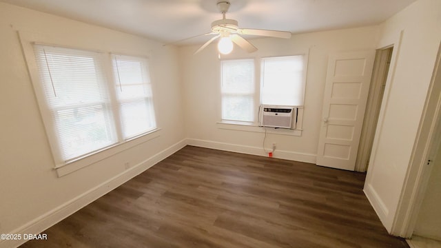 spare room featuring ceiling fan, cooling unit, and dark hardwood / wood-style flooring