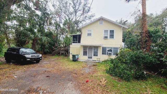 view of front of house featuring a sunroom