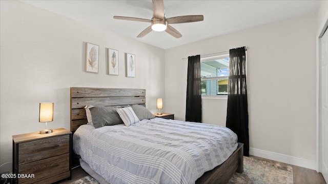 bedroom featuring a ceiling fan and baseboards