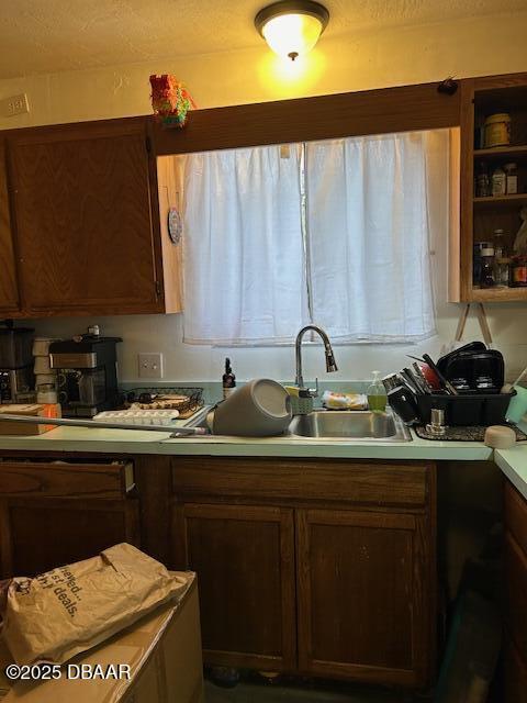 kitchen with a sink and light countertops