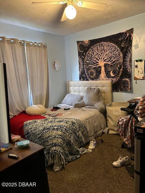 carpeted bedroom featuring ceiling fan