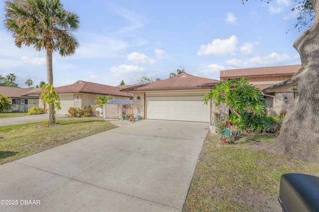 view of front of house featuring a garage and a front yard