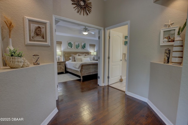 bedroom featuring dark wood-type flooring and ceiling fan