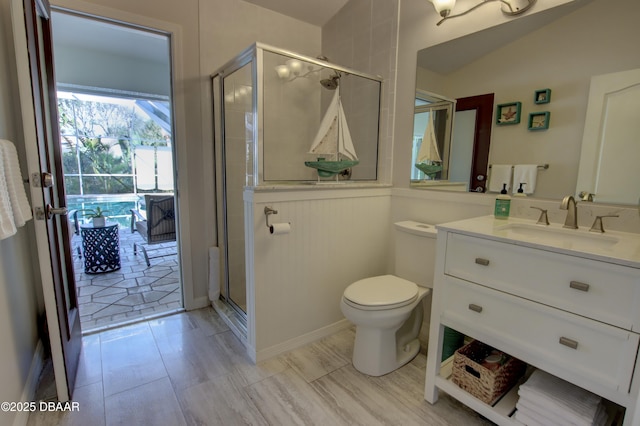 bathroom with vanity, toilet, and an enclosed shower