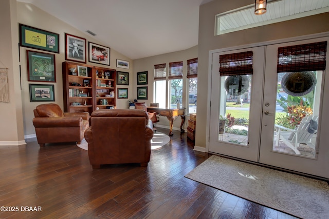 interior space featuring french doors, lofted ceiling, and dark hardwood / wood-style flooring