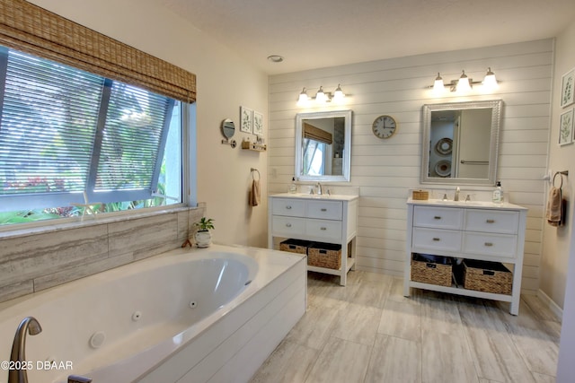 bathroom with vanity and a bathing tub