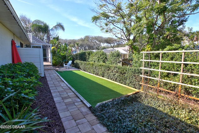 view of yard featuring a lanai