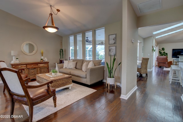 living room featuring lofted ceiling and dark hardwood / wood-style flooring