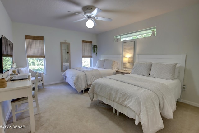 bedroom with ceiling fan and light carpet