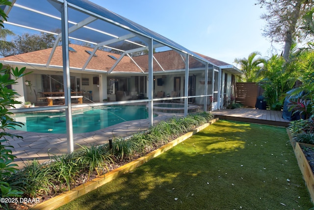 view of swimming pool with a lanai and a patio area